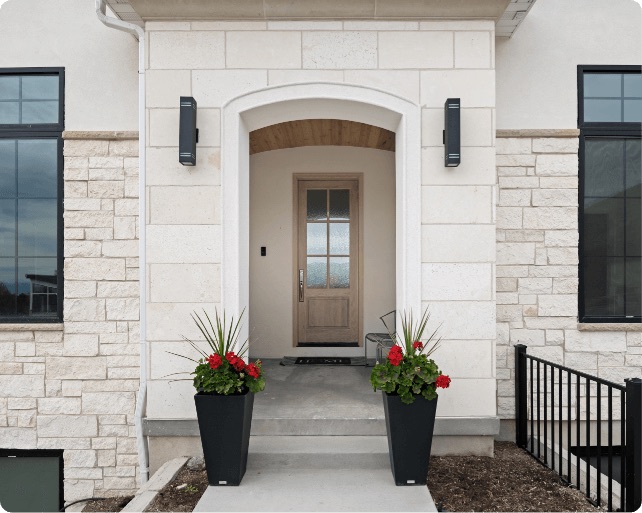 A front door with two planters on either side. Conner Construction Company, Pleasant Grove, Utah